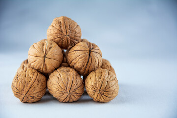 Pile of walnuts on white isolated background