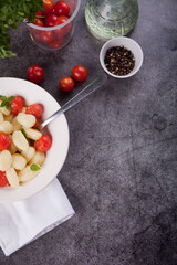 Homemade Italian gnocchi with tomato cherry. Top view