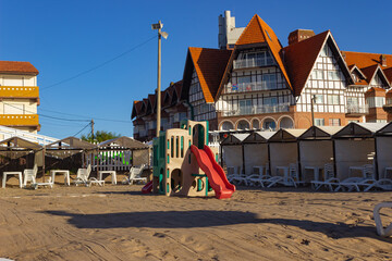 Fototapeta na wymiar Playground without kids on the sand on a sunny day.