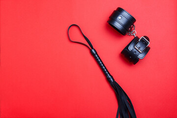 whip and handcuffs for the joys of BDSM. Role-playing games with toys from a sex shop. Shackles, beat, punishment and restraint for sadomasachism.