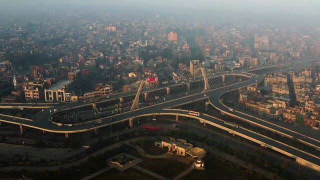 Top View Of Large Roundabout During Sunrise In Lahore, Pakistan - aerial drone shot
