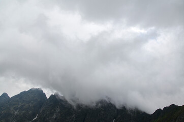Scenery of high green mountains, sky with clouds. High Tatras Slovakia. Beautiful mountain landscape