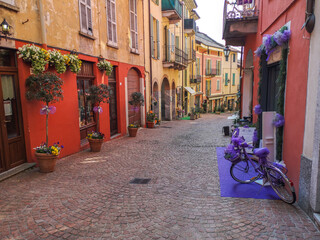 beautiful street in the historic center of Luino with flowers, lavender and porphyry