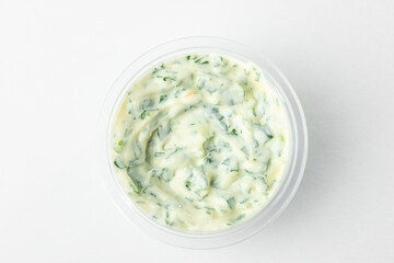 Small cup of tartar sauce, top view on white background