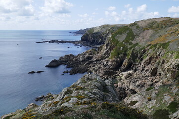 Obraz premium Rocky headland on coast of Guernsey