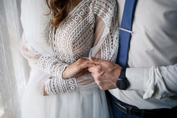 Newlyweds on wedding day, wedding couple holding hands, bride and groom