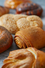 fresh buns on grey surface