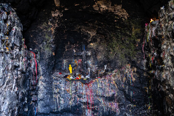 Grotto stone wall with colored candle wax
