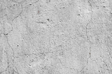 Texture of a concrete wall with cracks and scratches which can be used as a background