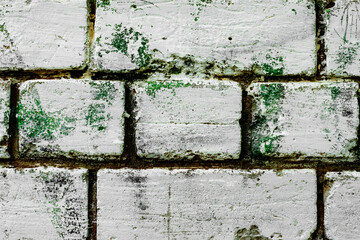 Texture of a brick wall with cracks and scratches which can be used as a background