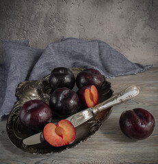 Vintage style still life with plums