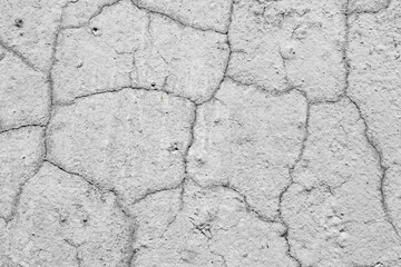 Texture of a concrete wall with cracks and scratches which can be used as a background