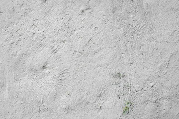 Texture of a concrete wall with cracks and scratches which can be used as a background