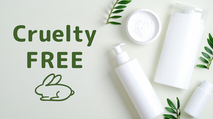 SPA cosmetic bottle containers and cream jar with green leaves. Cruelty free cosmetics set on green background.