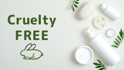 Cruelty free cosmetics set on green background.