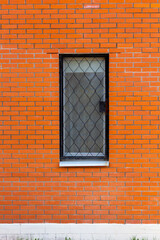 A window in a brick wall. Old building.