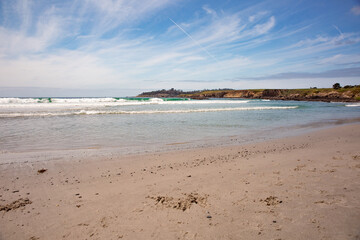 The Pacific Ocean coast in the city of Monterey in California. United States of America. Beautiful beach on a sunny day. Ocean landscape.