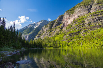 Fototapeta na wymiar Avalanche Lake and surrounding mountain range at Glacier National Park