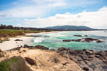Obraz premium The Pacific Ocean coast in the city of Monterey in California. United States of America. Beautiful beach on a sunny day. Ocean landscape.