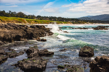 The Pacific Ocean coast in the city of Monterey in California. United States of America. Beautiful beach on a sunny day. Ocean landscape.