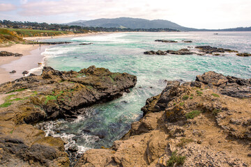 The Pacific Ocean coast in the city of Monterey in California. United States of America. Beautiful beach on a sunny day. Ocean landscape.