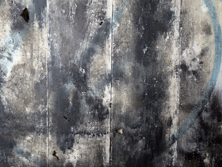 Black and white  sprayed on a grey concrete wall