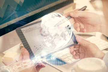 Multi exposure of man's hands holding and using a digital device and map drawing. International business concept.