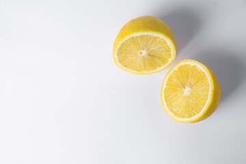 Lemon in cut on a white background. fresh and juicy lemon, cut in half. background