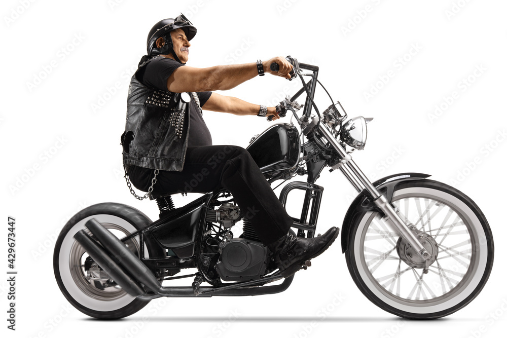 Wall mural Mature biker riding a chopper motorbike