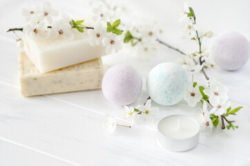 Fototapeta na wymiar soap banner. Aromatic natural soap with flowers, and bath bomb on a white background, close up