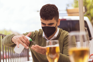 young businessman deifecting his hands before eating