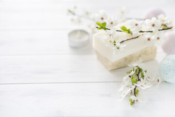 Obraz na płótnie Canvas soap banner. Aromatic natural soap with flowers, and bath bomb on a white background, close up