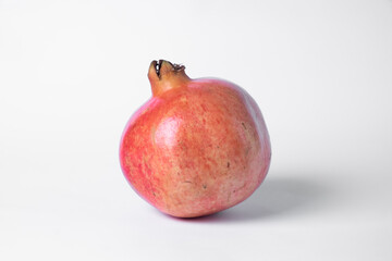 Pomegranate fruit on a white background.