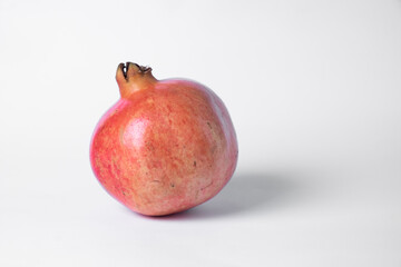 Pomegranate fruit on a white background.