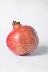 Pomegranate fruit on a white background.