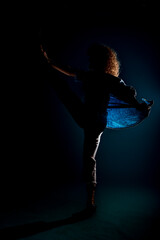 Modern style dancer  isolated on dark background