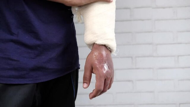 injured painful hand with bandage 