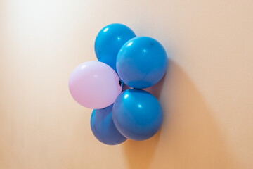 Balloons on the wall (blue and pink).