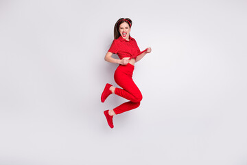 Fototapeta na wymiar Full length photo of crazy lady jump excited open mouth wear red dotted blouse trousers footwear isolated grey color background