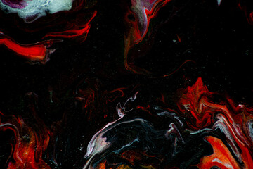 Texture in the style of fluid art. Abstract background with swirling paint effect. Liquid acrylic paint background. Black, yellow, white, lilac and red colors.