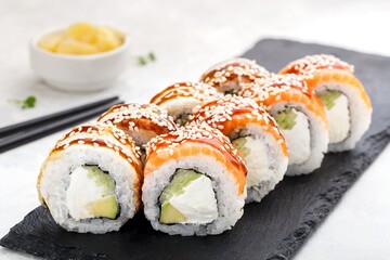 Sushi roll set with salmon,ell, avocado, cucumber,cream cheese, sesame and sauce. Sushi menu. Japanese food.