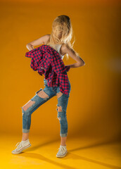 Young Woman In Yellow Tanktop And Eye Glasses Against Yellow Background