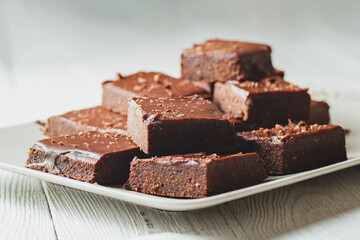 Pieces of chocolate brownie on a plate.