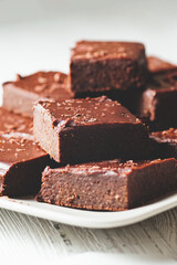 Pieces of chocolate brownie on a plate.