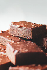 Pieces of chocolate brownie on a plate.
