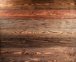 Fototapeta premium Textured background from brown wooden boards.