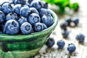 Fresh blueberries background with copy space for your text. Blueberry antioxidant organic superfood in a bowl concept for healthy eating and nutrition