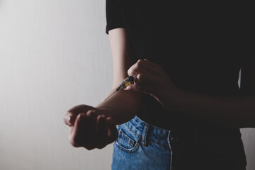 girl with gloves holding a syringe in her hand