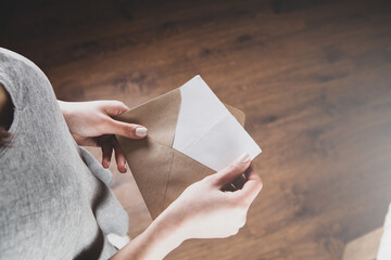 girl holding mail correspondence in her hand