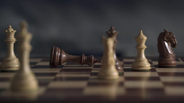 Chess pieces are located on a chessboard. The game in action tactics has been built which final is not yet known by who. In the dark, the party has been going on for 4 hours.